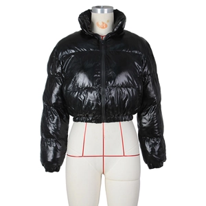 Detail of glossy black cropped puffer jacket featuring a stand-up collar and elastic cuffs