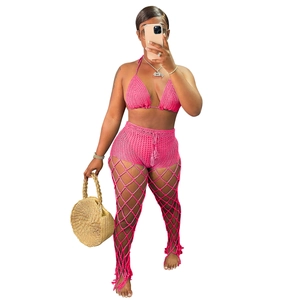 Detail of pink crochet 3-piece set featuring hollow mesh knit texture and beachwear design