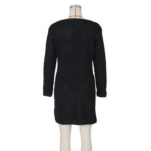 Detail of black knit dress showing long sleeves and high-quality weave texture