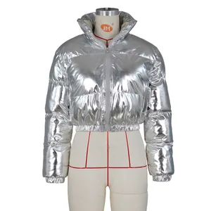 Detail of silver metallic puffer jacket showing reflective mirror finish and quilted texture