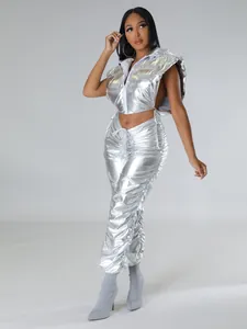 Detail of metallic silver hooded puffer vest and matching high-waisted pleated joggers