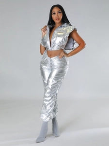 Detail of metallic silver vest and ruched pants showing reflective liquid metal texture