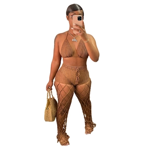 Detailed close-up of handmade crochet three-piece beach set with hollow mesh pattern