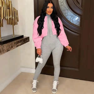 Close-up of pink faux fur jacket paired with a grey ribbed high-neck bodysuit