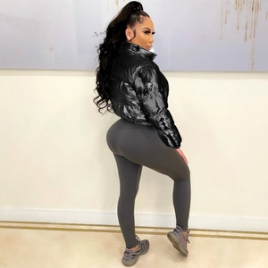 Side view of a glossy black cropped puffer jacket with high collar and warm padding