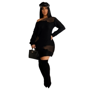 Detail of black cut-out knit dress featuring long sleeves and off-shoulder neckline style