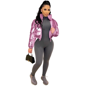 Detail of pink metallic cropped puffer jacket with stand collar and shiny mirror finish
