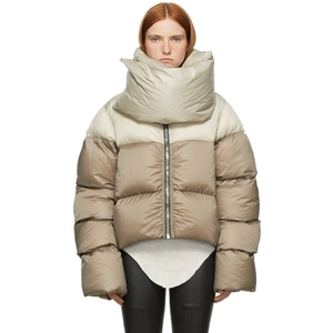 Detail view of winter puffer jacket featuring two-tone color block and oversized scarf collar