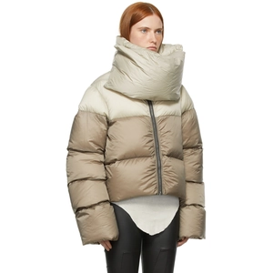 Detail of puffed winter jacket featuring a high scarf collar and beige brown color blocking