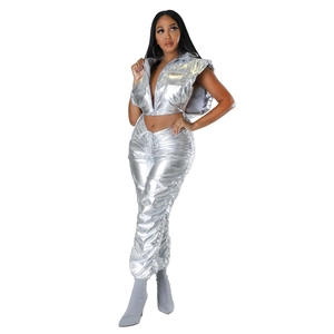 Detail of silver metallic cropped puffer vest with hood and matching drawstring pants