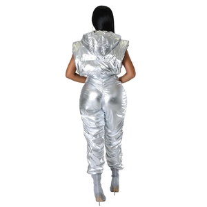 Back view of a futuristic silver metallic puffer vest with a high-shine reflective finish