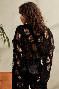Detailed back view of women black hollow out knit sweater with ripped texture and drop shoulder