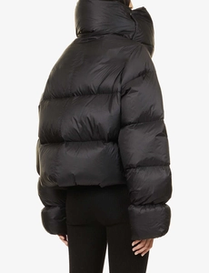 Rear view of a black oversized puffer jacket featuring a high stand collar and quilted design