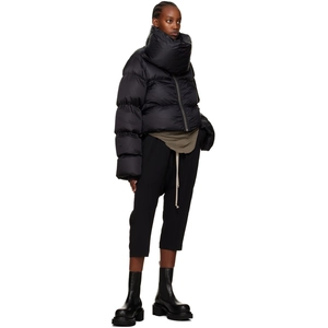 Detail of black quilted puffer jacket featuring an oversized scarf collar and zipper closure
