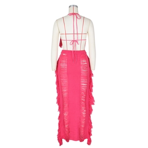 Detailed back view of a rose red knit beach set featuring tassel fringes and cutout details