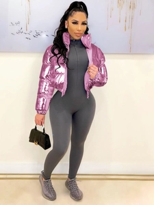 Chic pink metallic puffer jacket with stand collar and slim fit grey jumpsuit outfit