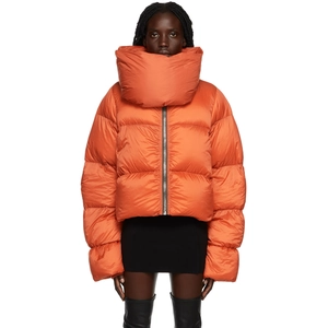 Detail showing bright orange puffer jacket with high stand collar and metallic zipper