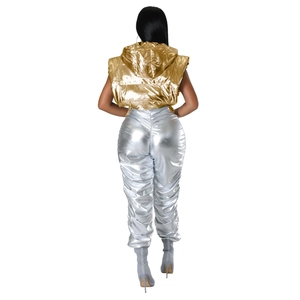 Metallic gold hooded puffer vest and silver reflective trousers set shown from the back