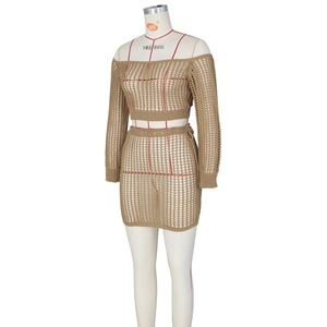 Detail of khaki crochet two-piece set featuring hollow-out knit pattern and side lace-up skirt
