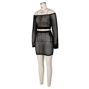 Close-up of black mesh knit two-piece beach set showing intricate hollow-out texture