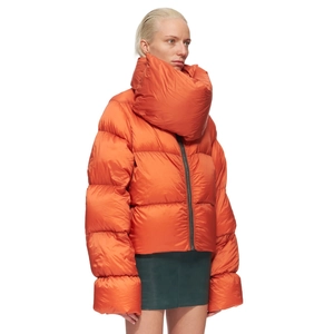 Detail of puffer jacket showing the bright orange fabric and oversized scarf collar