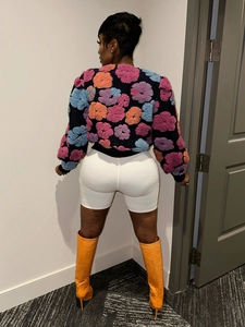 Detailed back view of a plush short jacket featuring colorful 3D floral textures and patterns