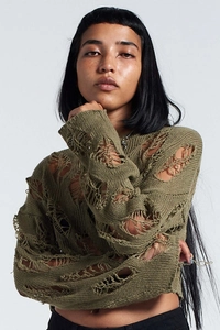 Detailed view of olive green distressed knit crop top with aesthetic hollow out texture