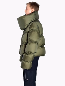Detail view of olive green oversized puffer jacket featuring a giant funnel neck collar
