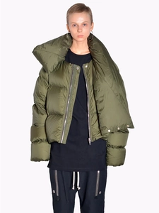 Detail of army green puffer jacket featuring an oversized scarf collar and silver zipper