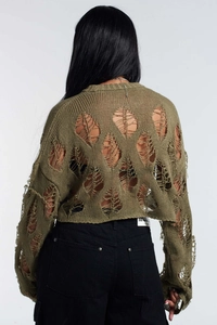 Detailed back view of an olive green knit crop top with trendy hollow-out distressed patterns