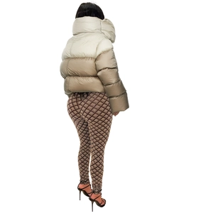 Detail view showing a two-tone stand-up collar winter jacket with beige and grey panels