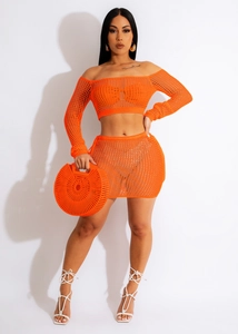 Detail of orange hollow-out crochet knit two-piece beach set with mesh texture