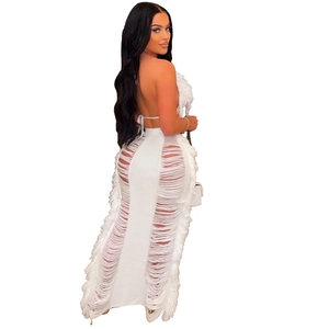 Detailed knit pattern on white halter dress with fringe tassels and cutout weave