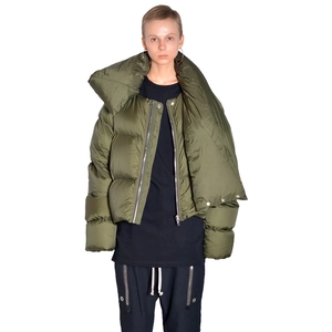 Detail of olive green puffer jacket featuring asymmetrical neck and high-gloss finish
