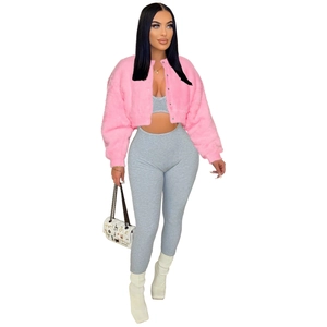 Detail view of pink faux fur jacket with ribbed tank top and matching trousers set