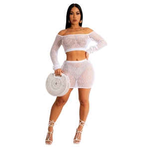 Detail of white crochet knit two-piece beach set featuring mesh hollow-out texture