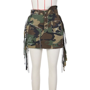 Detail of high-waist camouflage mini skirt with long fringe tassels and frayed edges