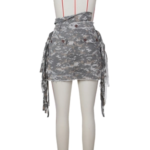 Detail of digital camo skirt featuring side fringe accents and frayed hemline texture