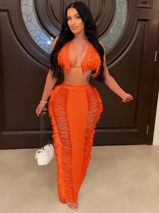Women's orange two-piece knit beach set with halter fringe top and cutout maxi skirt