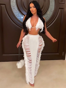 Sexy white two-piece knit beach set featuring a halter top and long fringe skirt