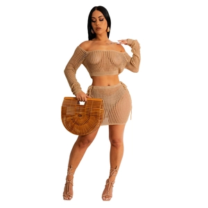Detail of khaki crochet two-piece set featuring hollow knit texture and side drawstring