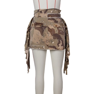 Macro shot of desert camo mini skirt with fringe details and distressed frayed edges
