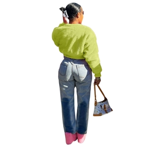 Back view of lime green faux fur jacket showing plush texture and short crop cut