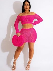 Fuchsia crochet knit two-piece set featuring off-shoulder crop top and mini skirt