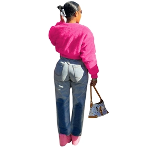 Back view of a vibrant rose pink faux fur short jacket for women in autumn fashion