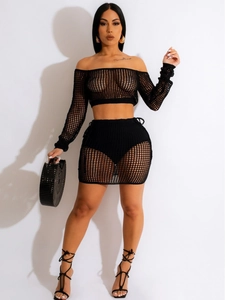 Women's two-piece black crochet knit beach set with long sleeve crop top and mini skirt