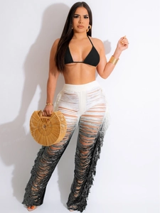 Women's summer knit set with black halter top and gradient fringe crochet pants