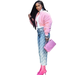 Detail of pink faux fur jacket and luxury blue jeans with quilted crossbody bag outfit