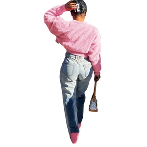 Rear view of women's pink faux fur cropped jacket with a fluffy texture and round neck