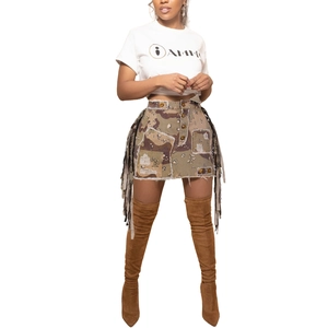 Detail shot of camo mini skirt featuring frayed edges and long fringe side accents